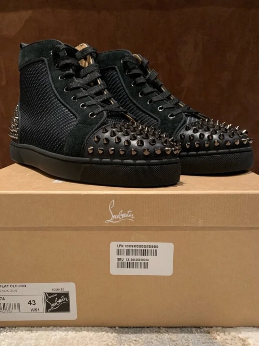 Men’s black Christian Louboutin size 43 (10US) Lou Spikes 2 Flat sneakers.